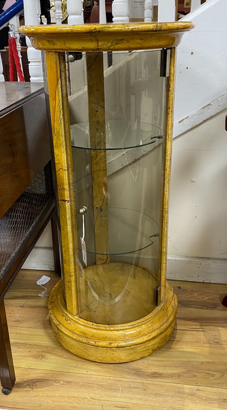 A pair of faux marble glazed cylindrical display cabinets, height 88cm, diameter 42cm